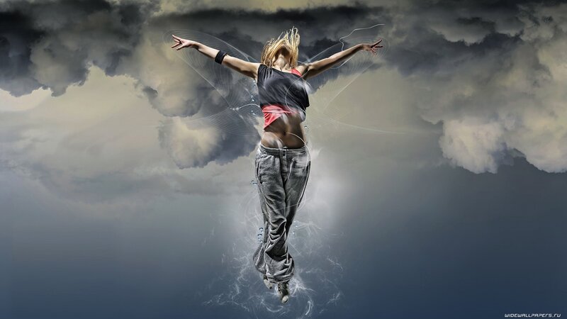 woman dancing in stormy sky