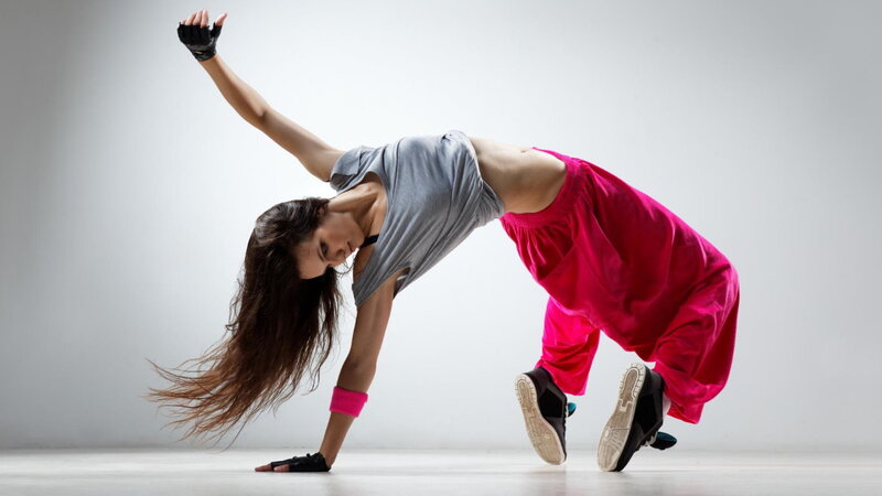 Woman Dancing in Studio — Gray, Dynamic, Photograph, Long Hair, Gloves