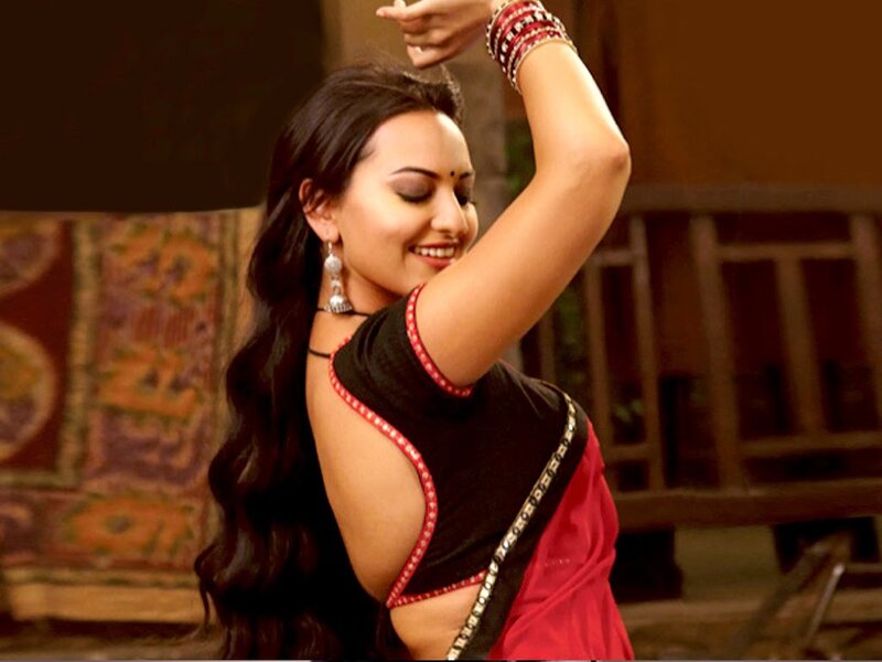woman dancing in traditional attire