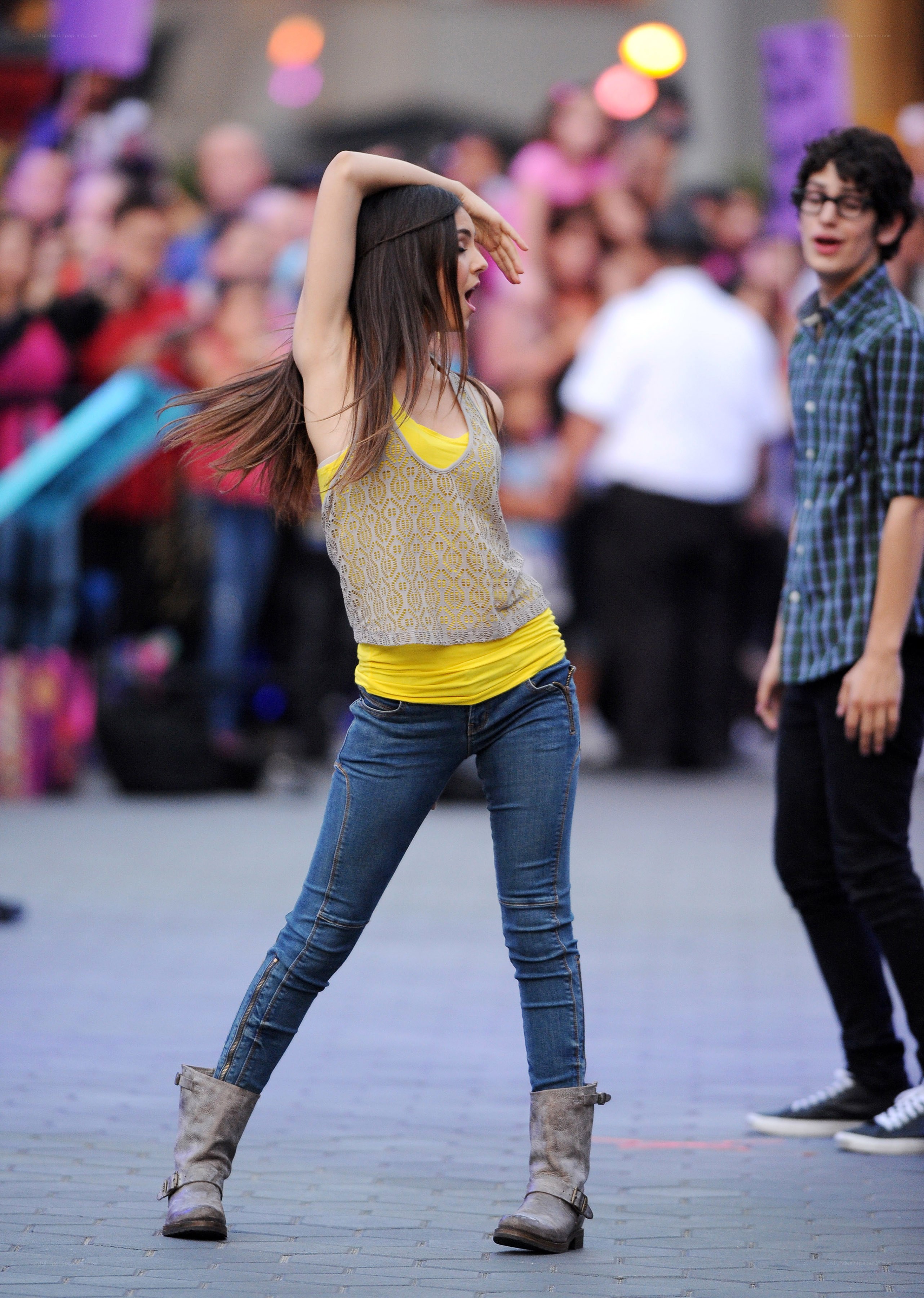 woman dancing in yellow top