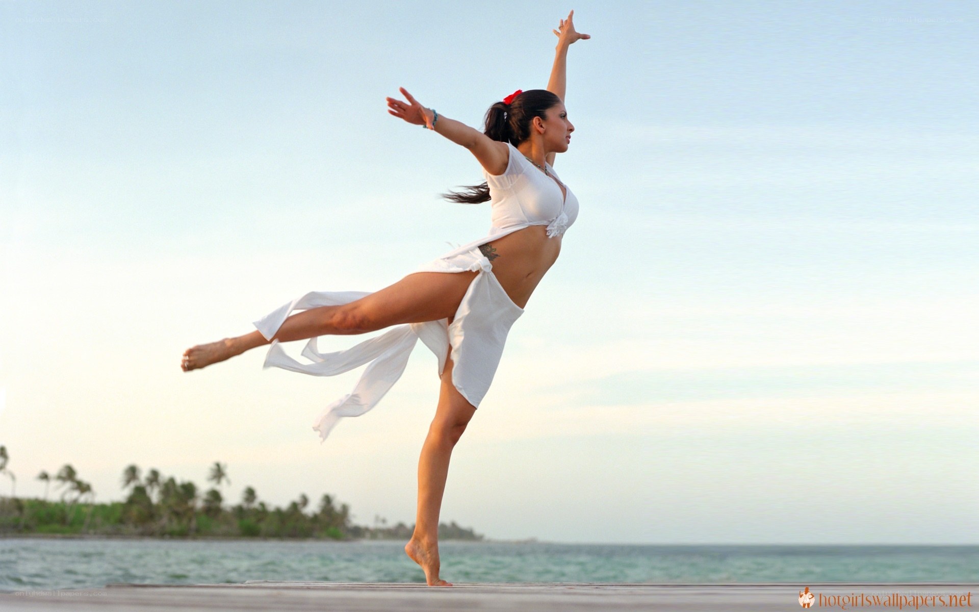woman dancing on beach
