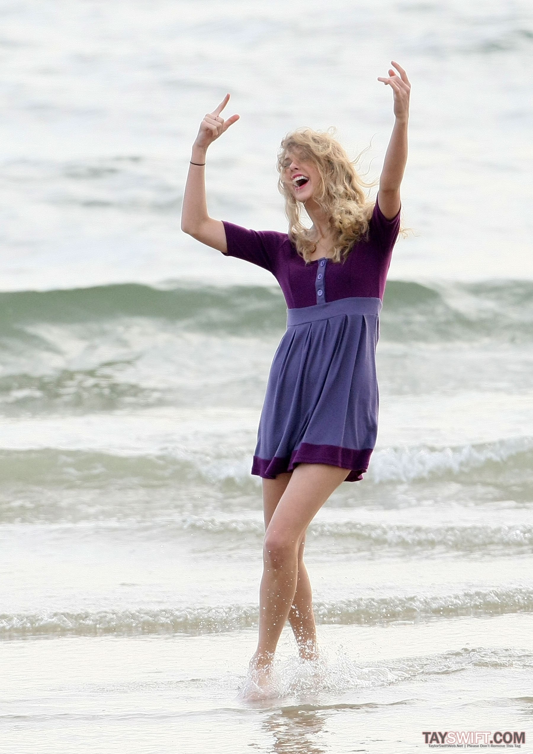 woman dancing on beach
