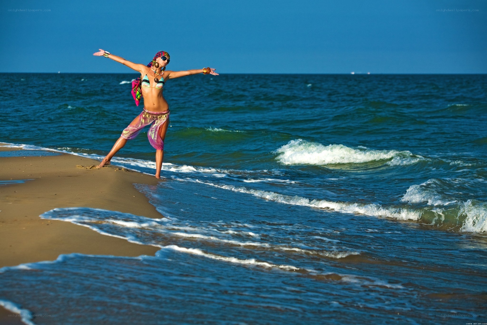 Woman dancing on beach
