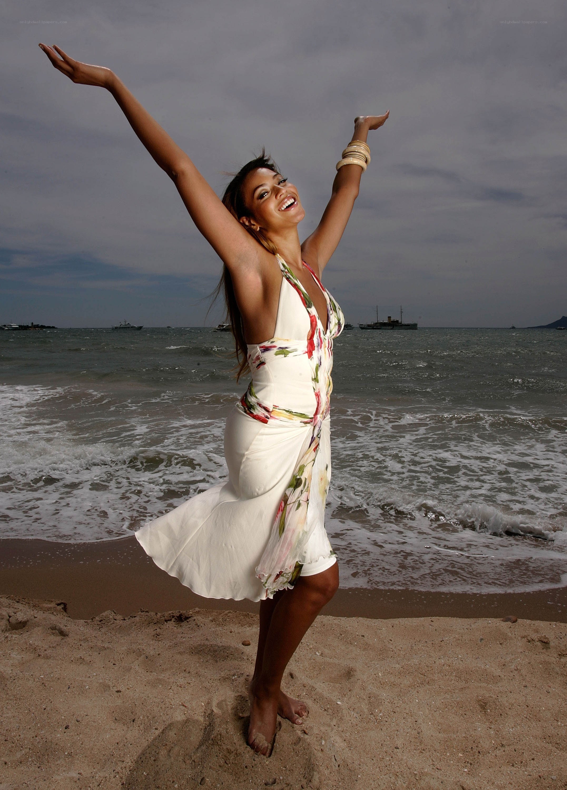 Woman dancing on beach