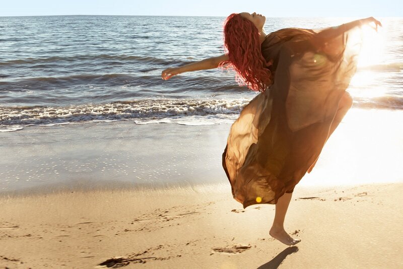 Woman Dancing on Beach — Brown