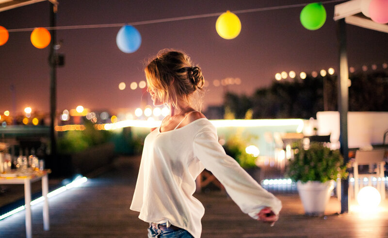 Woman Dancing on Rooftop — White