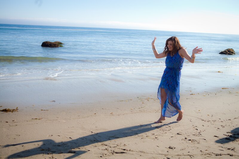 Woman dancing on the beach