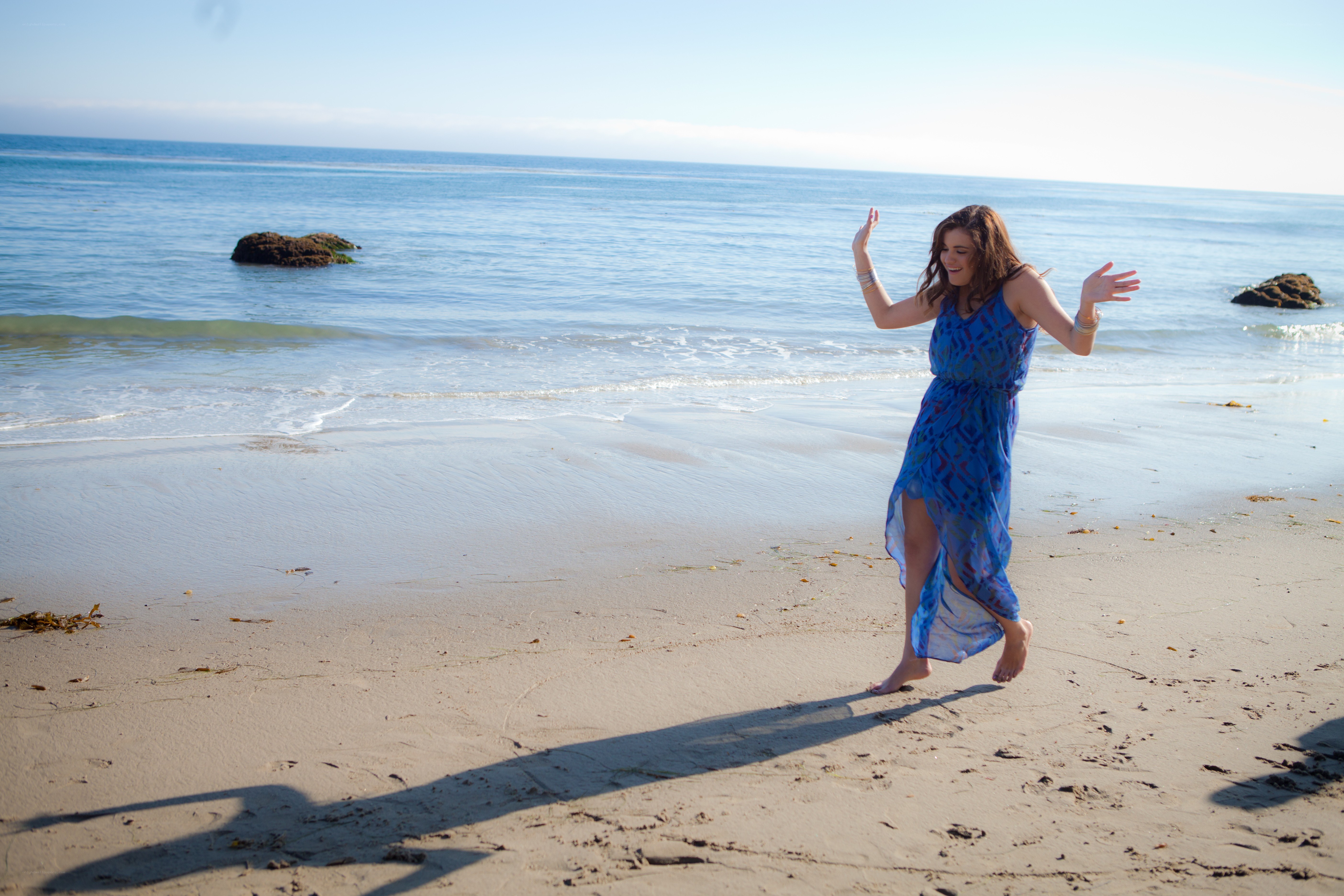 Woman dancing on the beach
