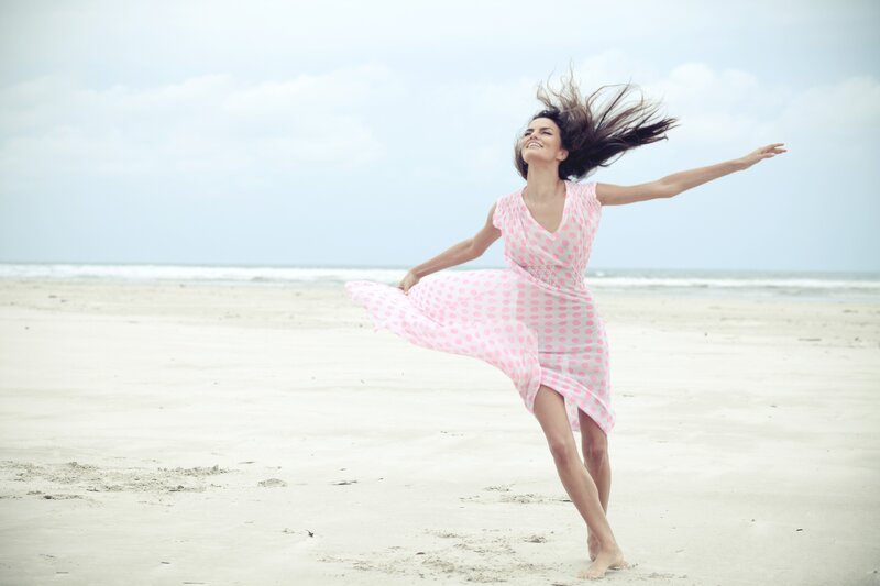 Woman dancing on the beach