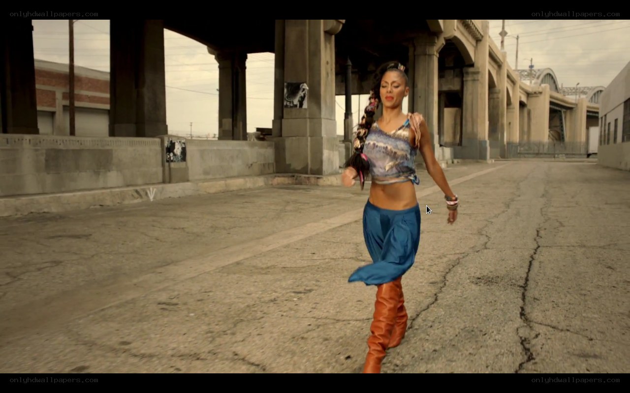 woman dancing under bridge