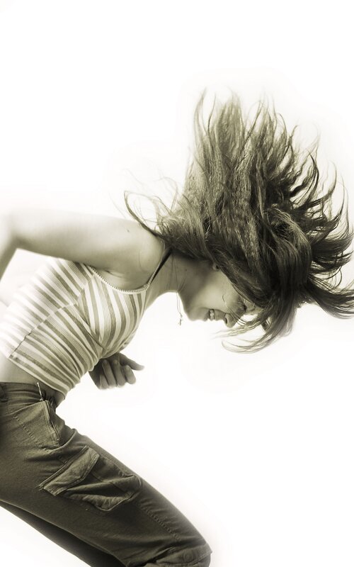 woman dancing with hair flying
