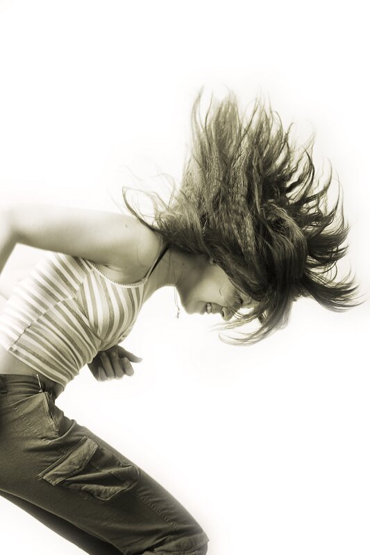 woman dancing with hair flying