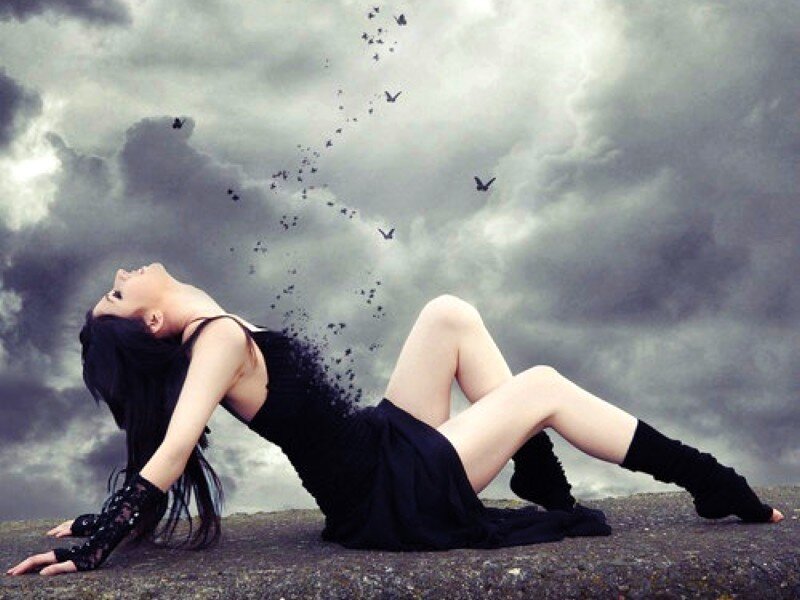 woman dissolving into birds