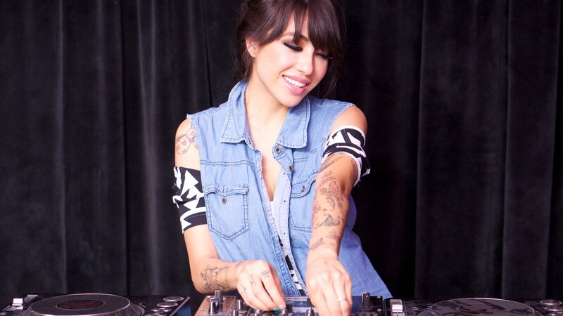 woman djing at turntables