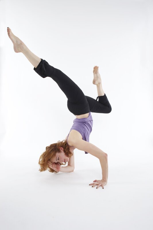 woman doing handstand yoga pose