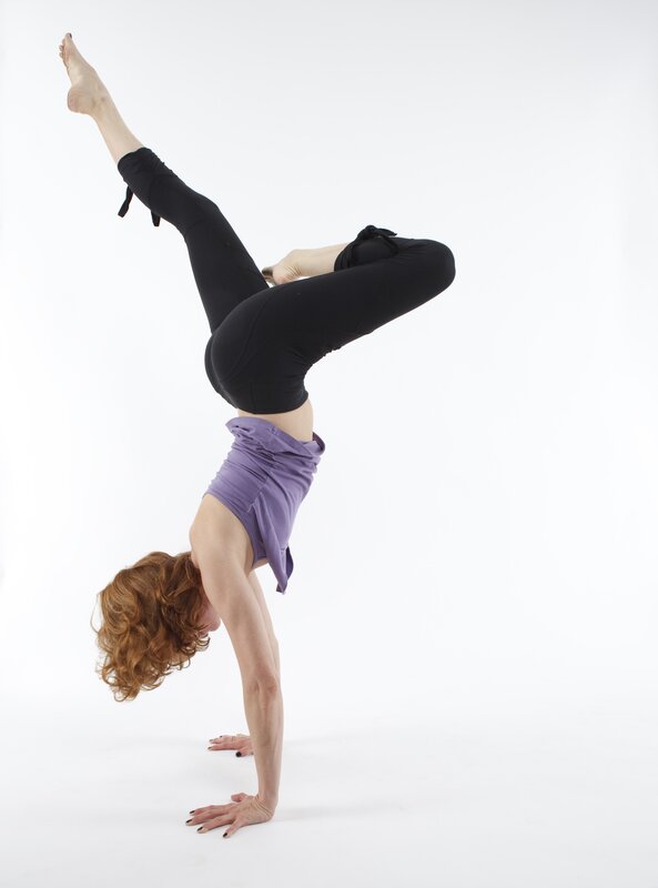 woman doing handstand yoga pose