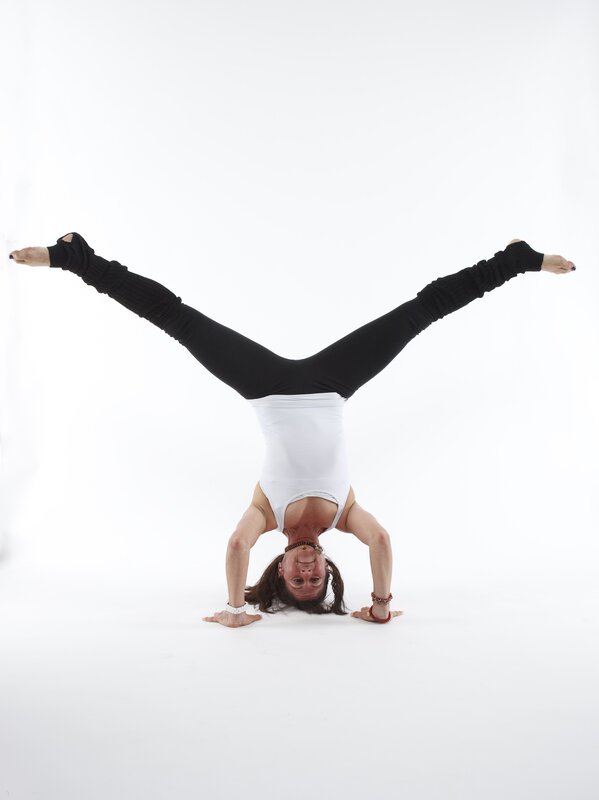 woman doing handstand yoga pose