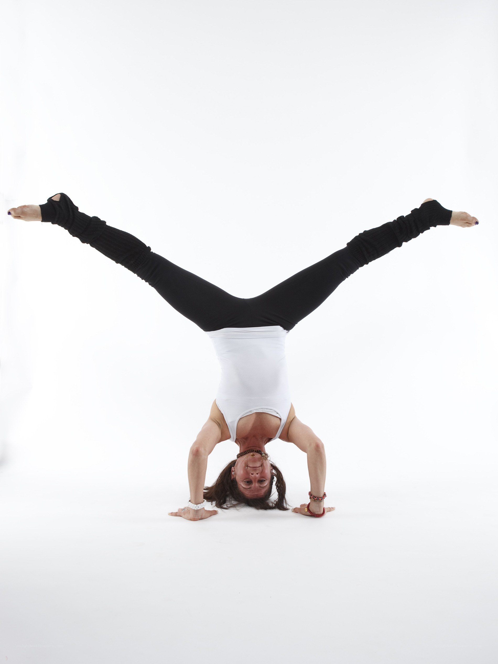 woman doing handstand yoga pose