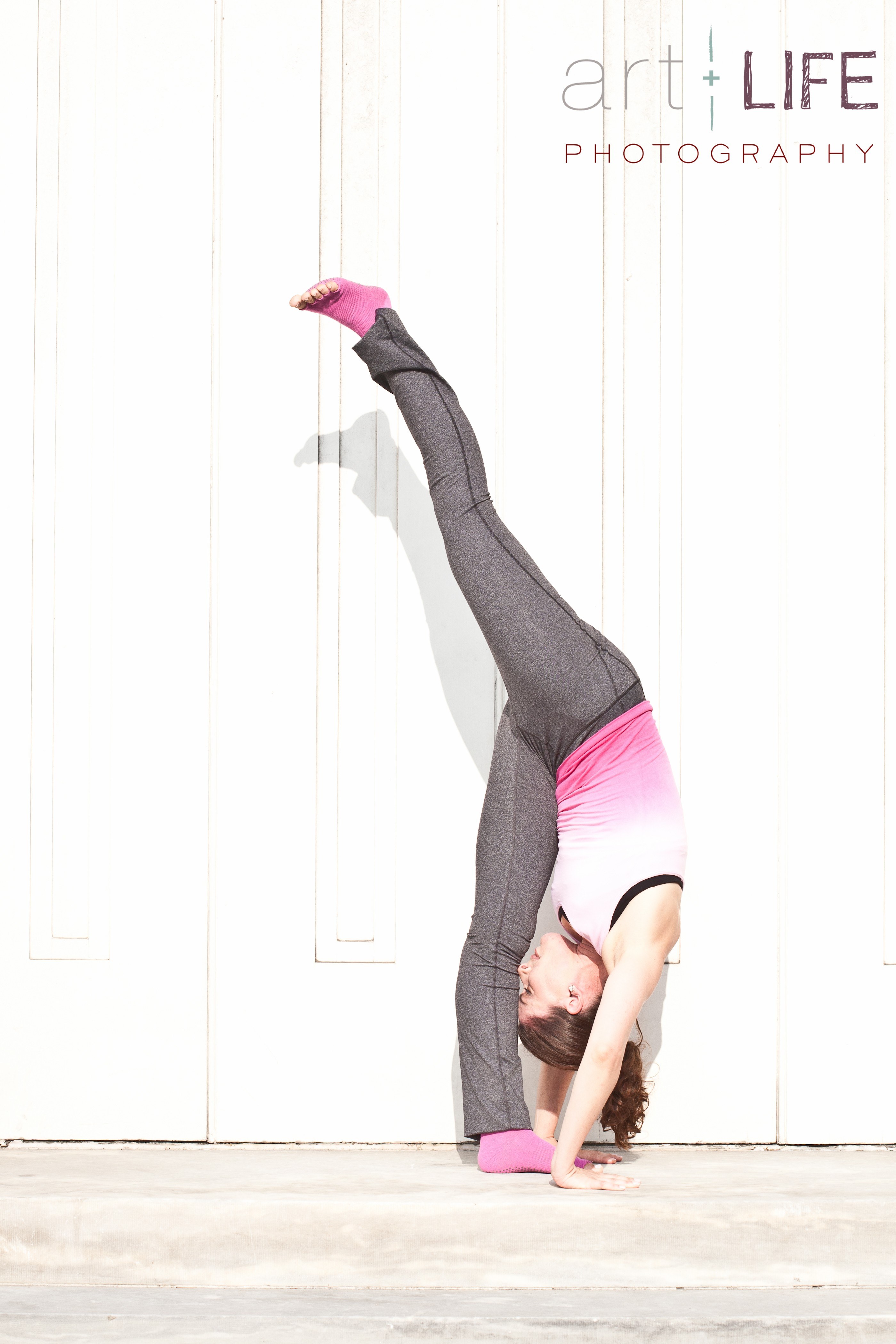 woman doing handstand yoga