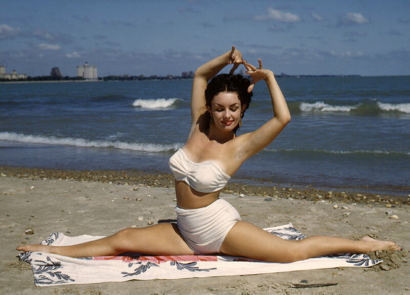 Woman Doing Split on Beach