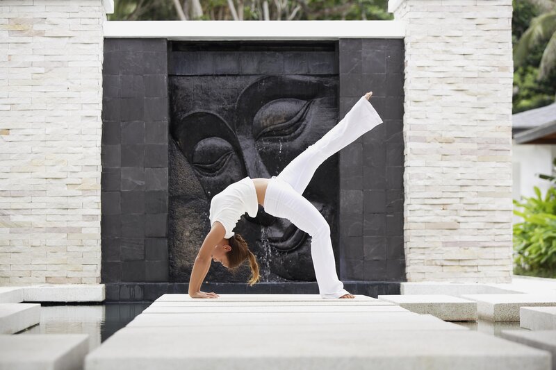 Woman doing yoga in garden