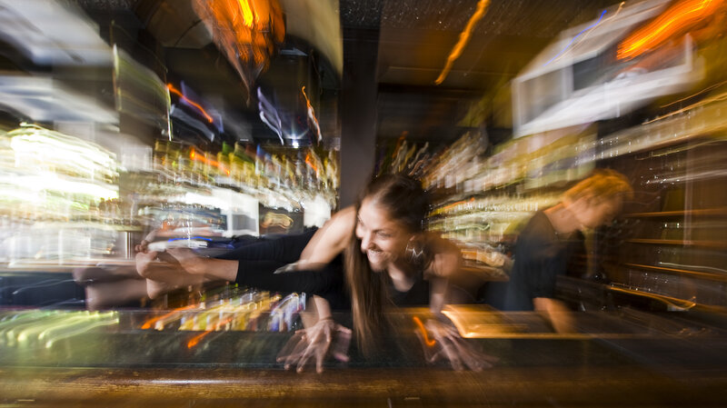 Woman Doing Yoga on Bar