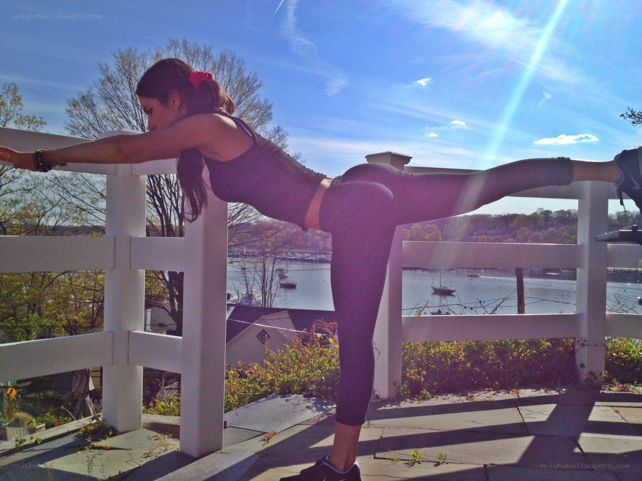 woman doing yoga on deck