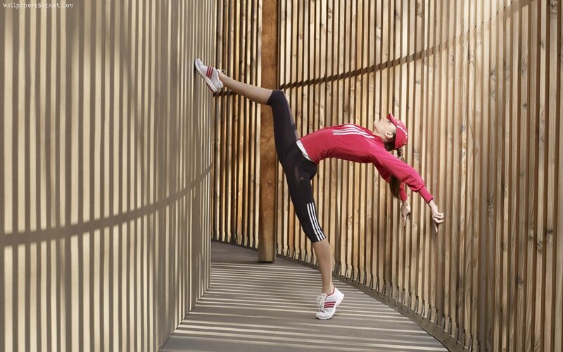 Woman Doing Yoga Stretch — Red