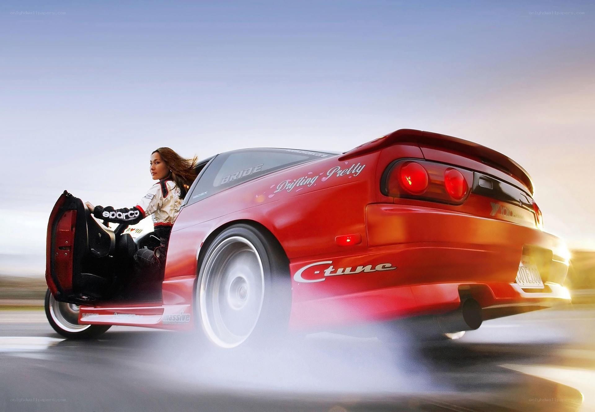 woman drifting in red car