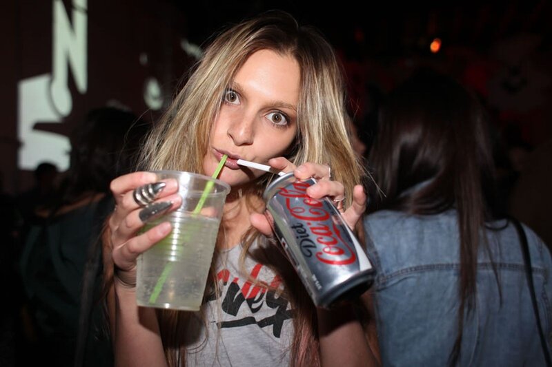 Woman drinking at a party