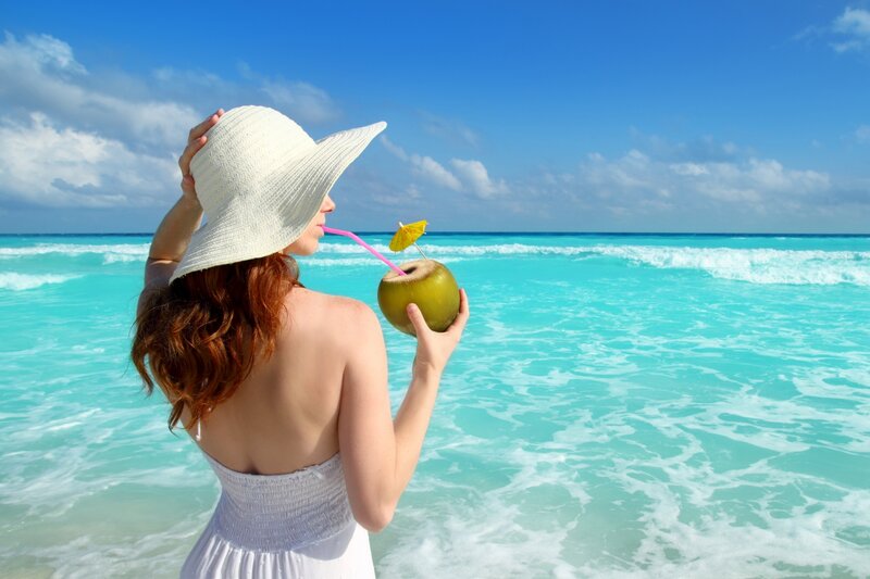 Woman Drinking Coconut