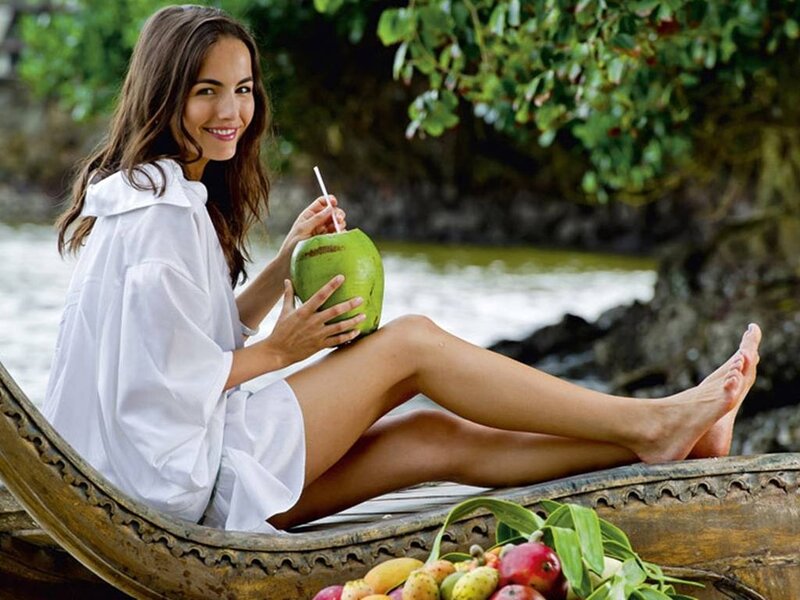 Woman Drinking Coconut — White