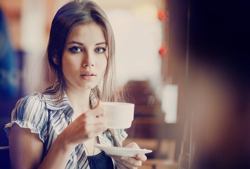 woman drinking coffee in cafe