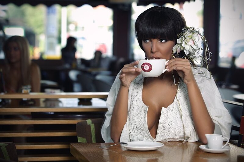Woman drinking coffee in cafe