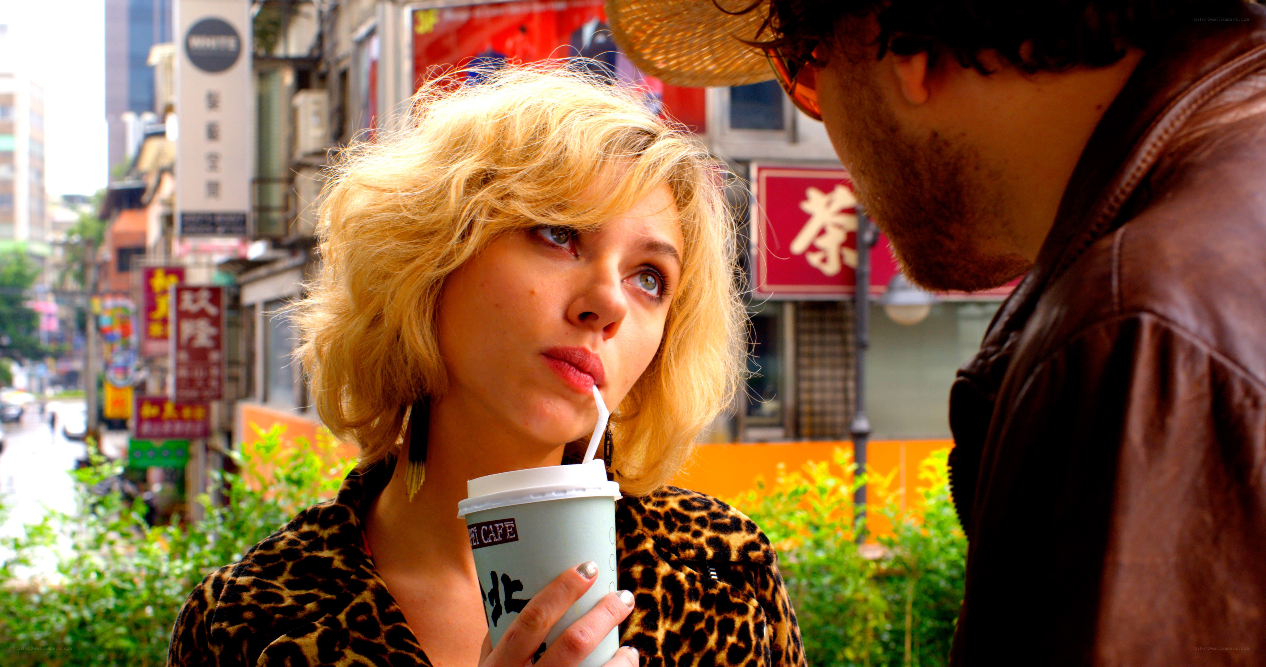 Woman drinking coffee on street