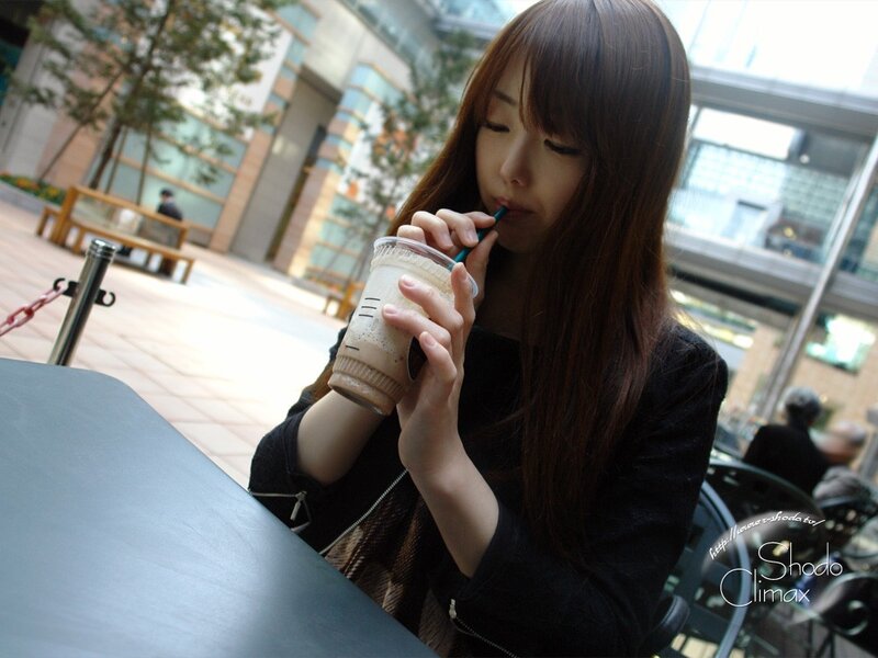 woman drinking coffee outdoors