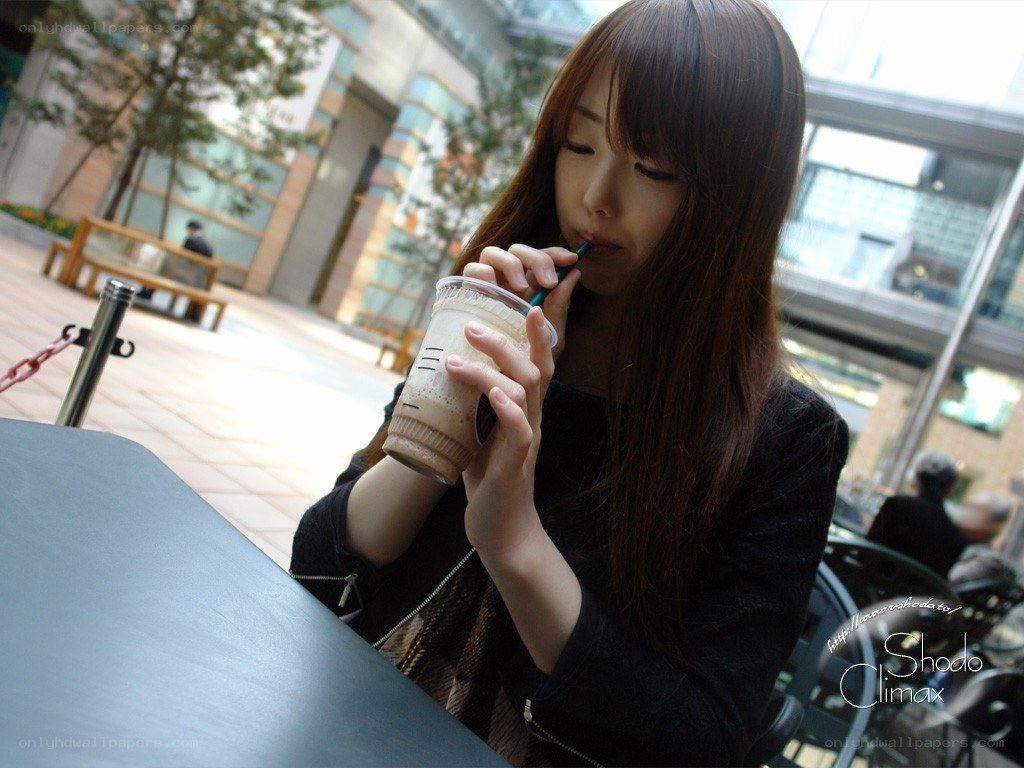 woman drinking coffee outdoors