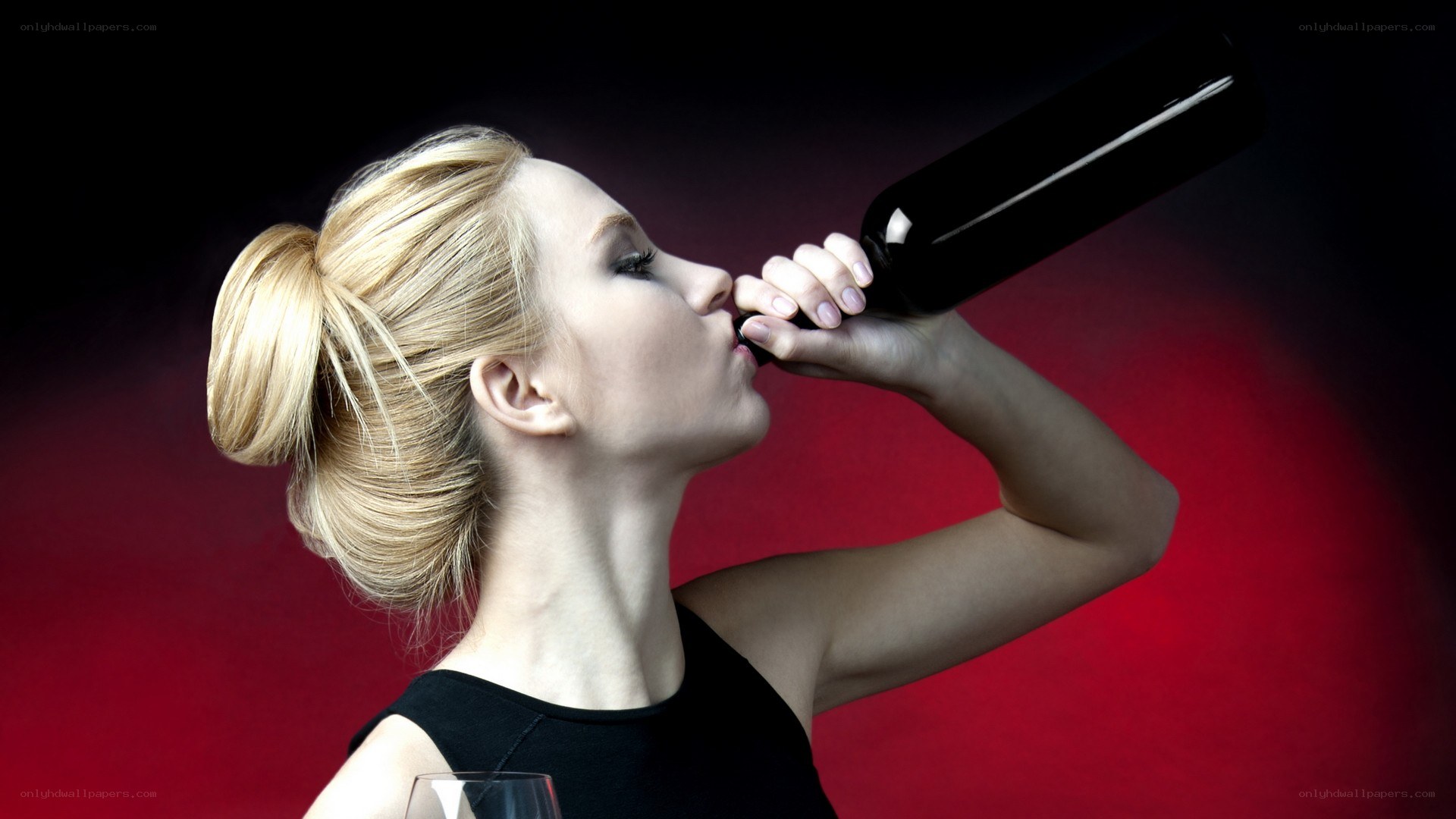 woman drinking from a bottle