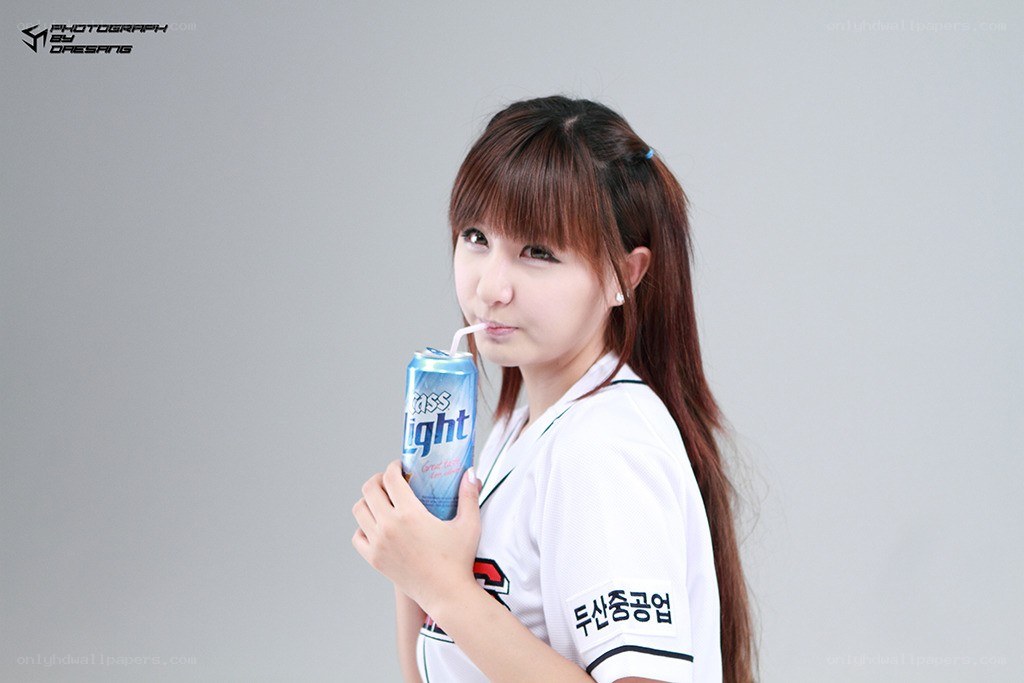 woman drinking from a can