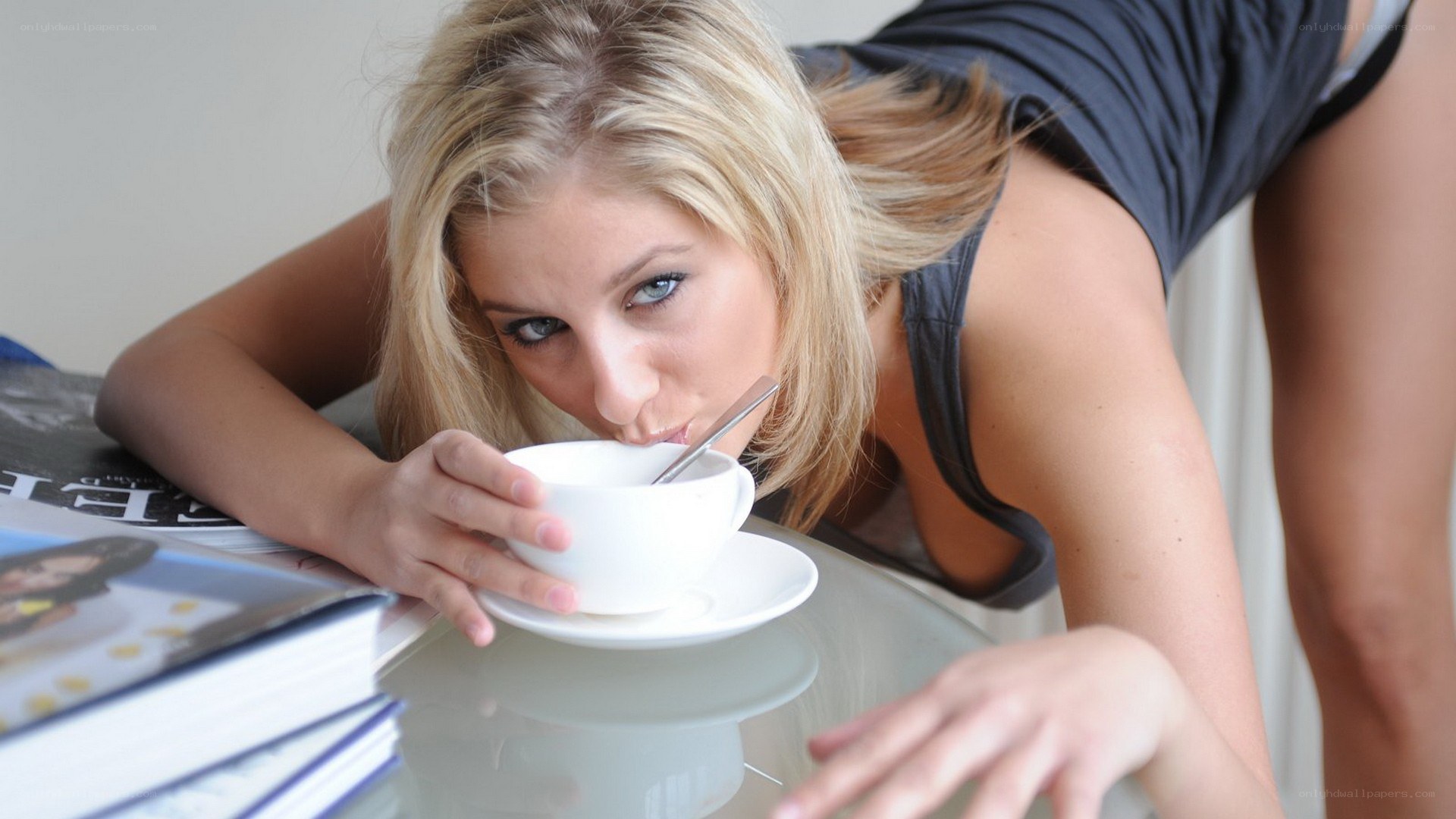 woman drinking from a cup