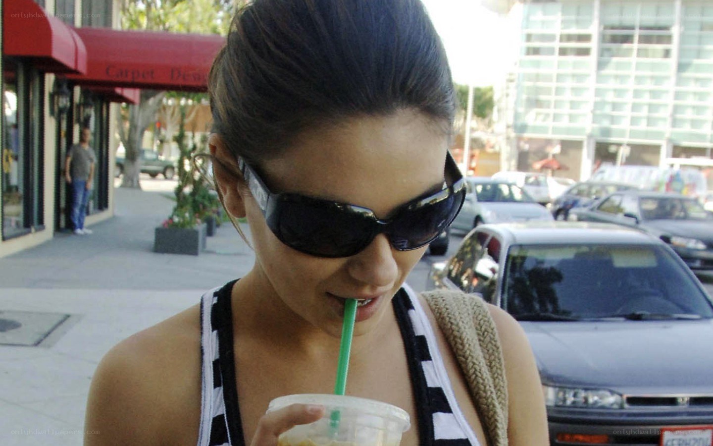woman drinking from a cup