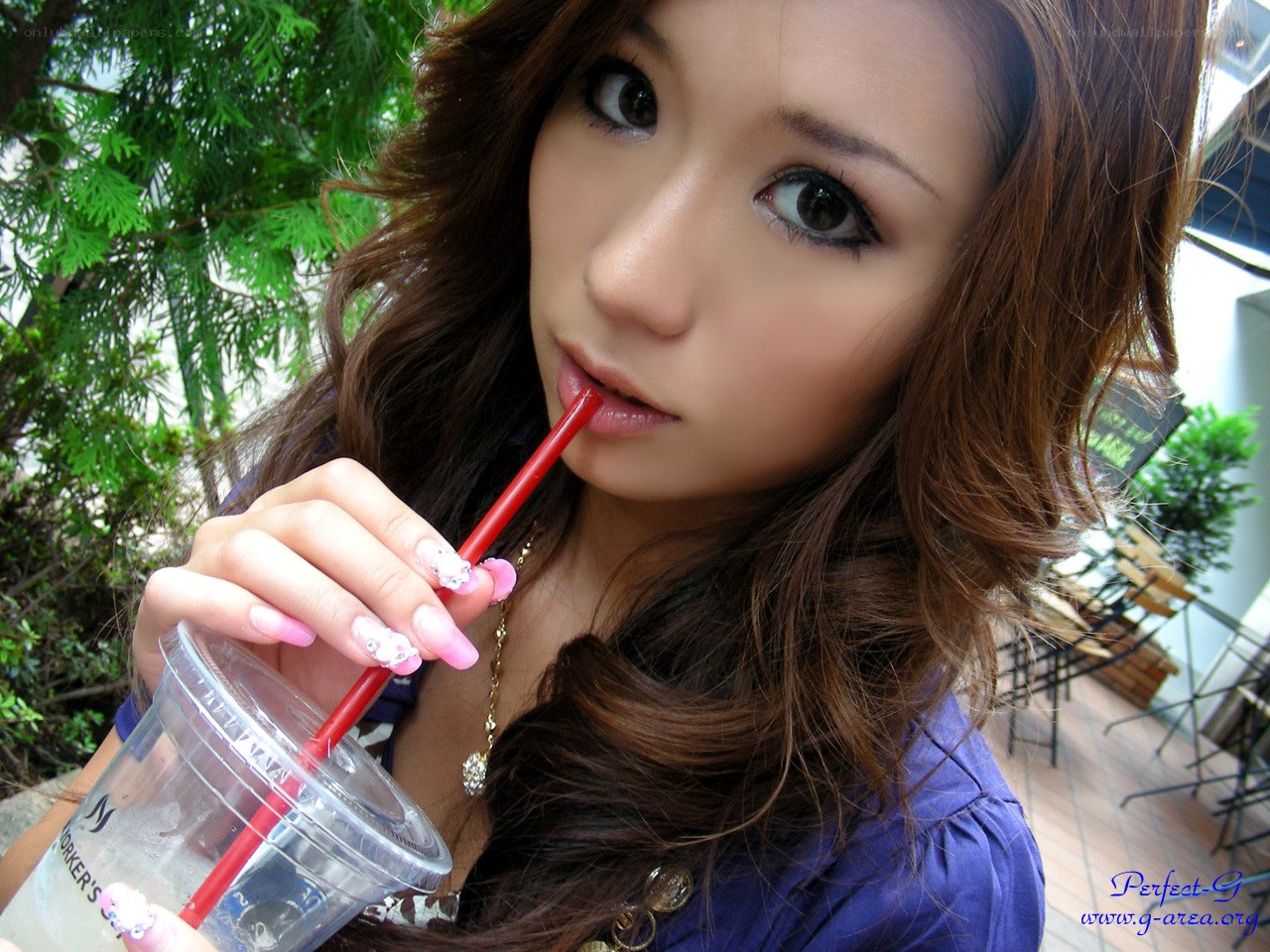 woman drinking from a cup
