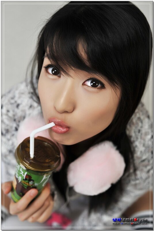 woman drinking from a cup