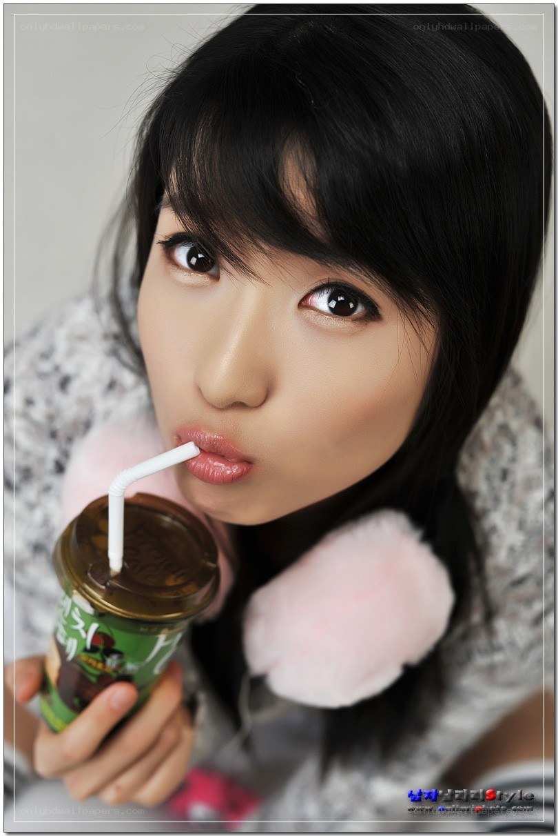 woman drinking from a cup