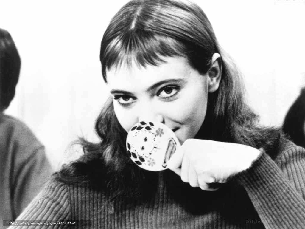 woman drinking from a cup