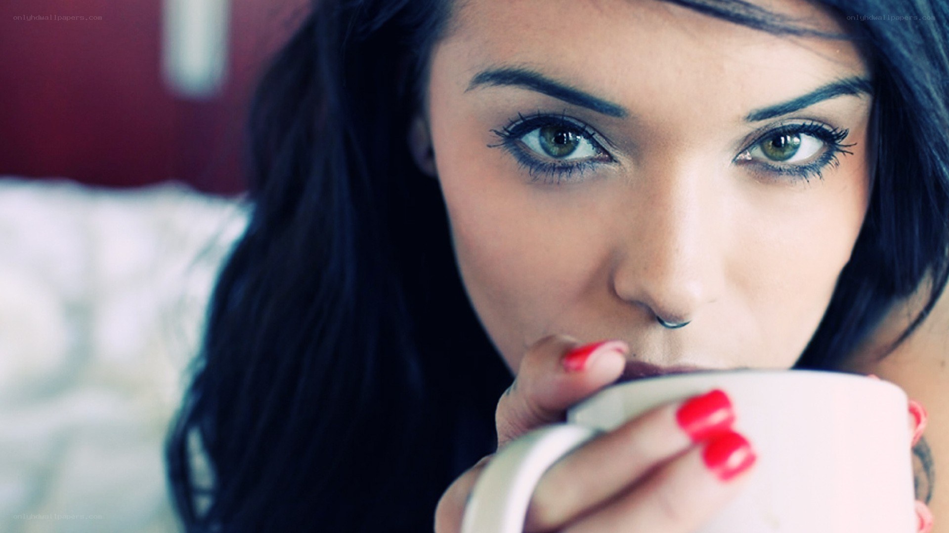 woman drinking from a mug