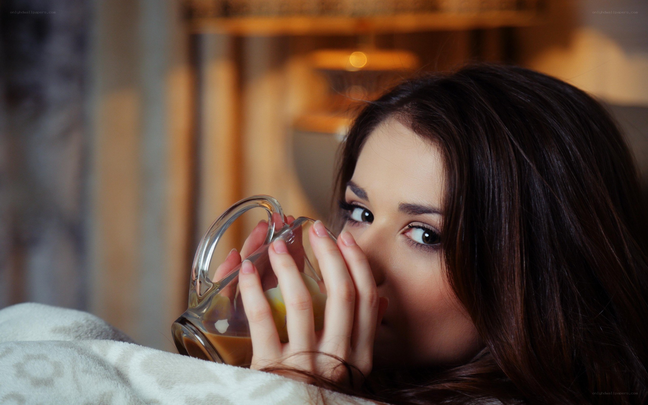 woman drinking from a mug