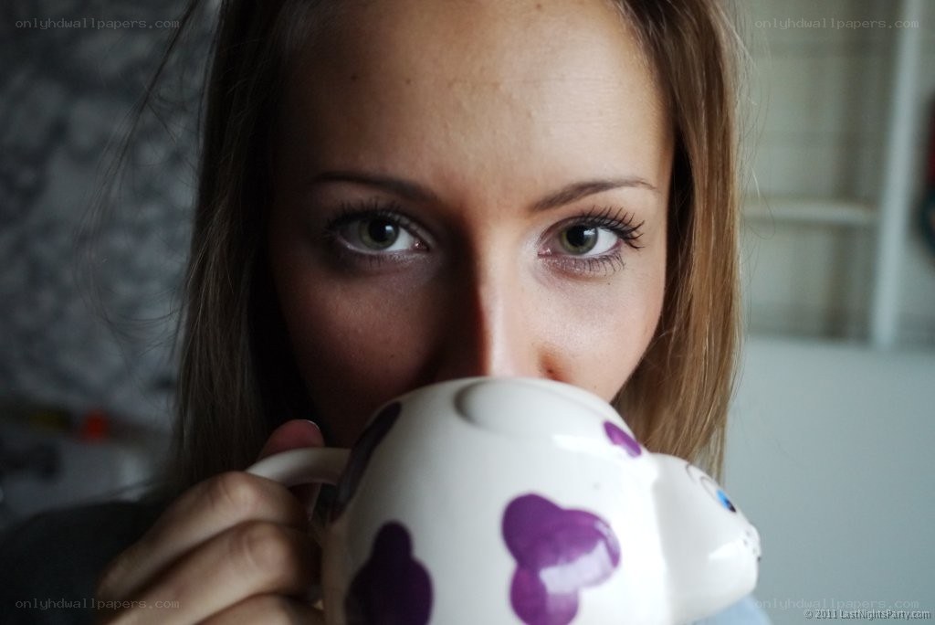 woman drinking from a mug