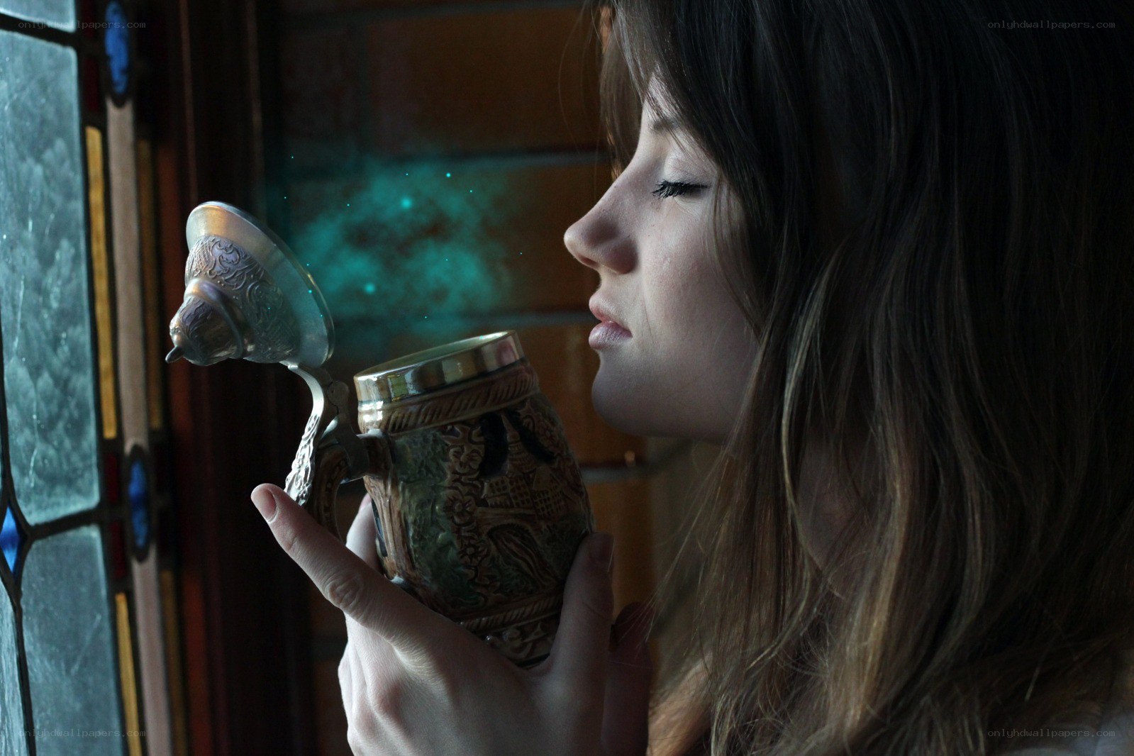 woman drinking from a mug