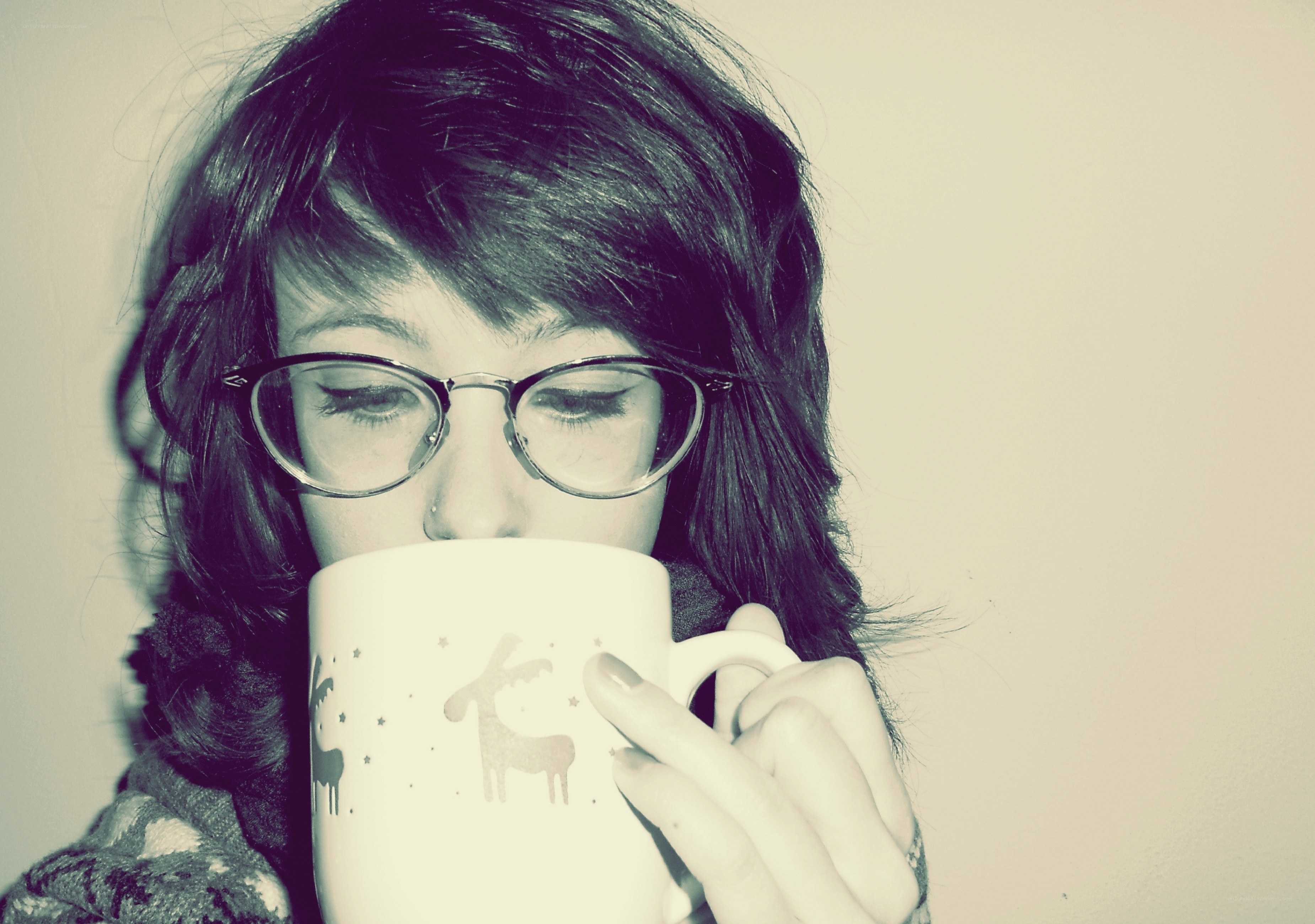 woman drinking from a mug